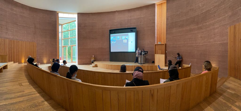 conference hall with screen and participants